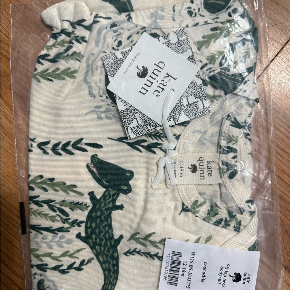 Kate Quinn Baby Bodysuit with Green Crocodile Print